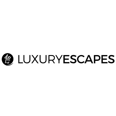 Luxury Escapes website showing a luxurious beach resort with exclusive member benefits highlighted, such as a private pool or spa